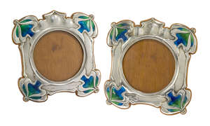 
	
		Hutton & Sons, a pair of Art Nouveau silver, oak and enamel photograph frames
		Mark of...
