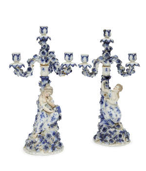 
	
		A pair of Sitzendorf porcelain four light candelabra, late 19th/early 20th century, the...