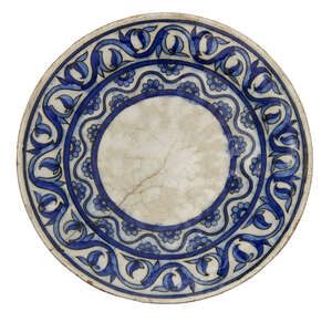 
	
		A Qajar pottery dish, Iran, 19th century, underglaze painted in cobalt and light blue,...
