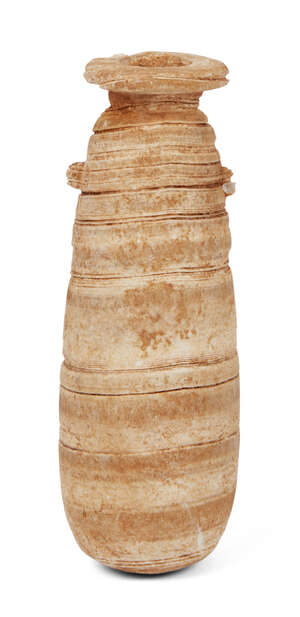 A Bactrian calcite cylindrical ritual vessel, 11th century B.C., with carved concentric grooves to body, 17cm. long
		Provenance: Property of a Lady