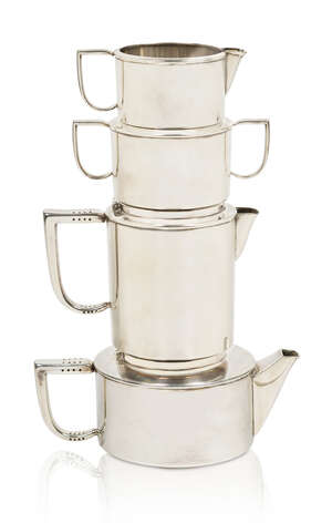 
	
		Cyril Shiner (1908-1989), an electro-plated nickel silver stacking tea set made by Slade...