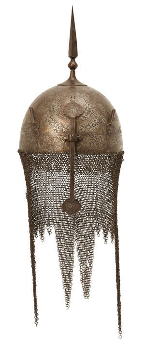 
	
		A Qajar gold damascened steel helmet and shield,
		Persia, 19th century, the helmet of...