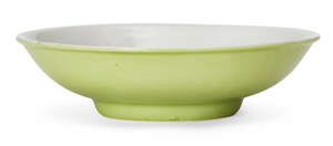 
	
		A small lime-green enamelled porcelain saucer dish, Jiaqing mark and of the period, base...