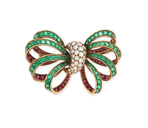 Kutchinsky. A diamond, emerald and ruby bow brooch, the centre pav&eacute;-set with brilliant-cut...