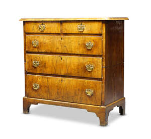 
	
		A George I walnut chest of drawers, c.1720, in two sections, the crossbanded top over two...