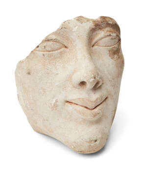 
	
		An Egyptian style limestone head of Amenhotep IV (Akhenaten) with elliptical eyes,...