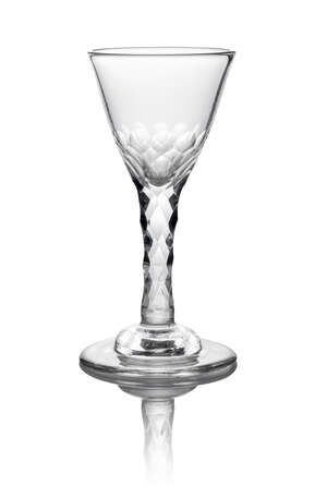 A George III wine glass, c. 1780, with conical bowl with faceting to the base on diamond facet stem, above domed foot, 16cm high
		 
		 
		 