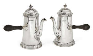 
	
		Two silver café-au-lait pots, one Sheffield, c.1912, maker's mark rubbed, the other...