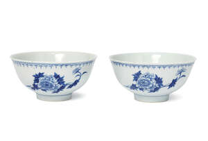 A pair of Chinese porcelain ogee bowls, 19th century, painted to the exterior with floral sprays, underglaze blue six-character mark to base, 12.5cm diameter