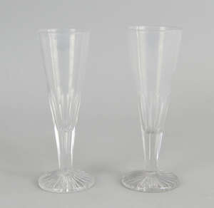 Two drinking glasses, 19th century, of tapering conical form with facetted stems on circular bases, 17cm high
		 
		 