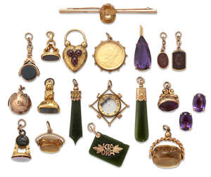 
	
		A collection of jewellery: comprising; eleven various fob seals; a zircon bar brooch; a...