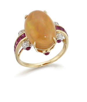 
	
		An opal, ruby and diamond ring, the oval cabochon opal to square-cut ruby line shoulders...