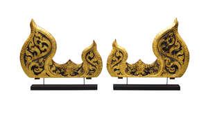 
	
		A pair of Thai carved giltwood 'jewelled' flame panels, late 19th/early 20th century, on...
