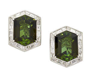 
	
		A pair of green tourmaline and diamond earclips, each clip with collet-set hexagonal-cut...