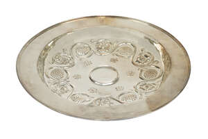 Duchess of Sutherland Cripples Guild, a large silver-plated copper dish
		c.1910, stamped D.S.C.G with coronet
		Embossed with vine, grapes and florets, plai
