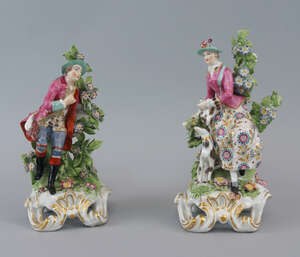 A pair of  porcelain figures of a lady and gentleman, probably Samson, in the manner of the Chelsea factory, late 19th/early 20th century, he dressed in a red 