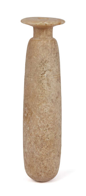 A Bactrian alabaster cylindrical vase, 11th century B.C., with wide, everted rim, rounded bottom, two fine lines incised around upper body, 21cm,. long
		Prov