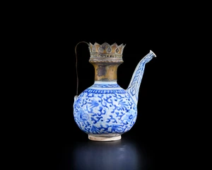 An engraved copper alloy mounted blue and white globular ewer,&nbsp;Zand Iran and possibly Armenia,...