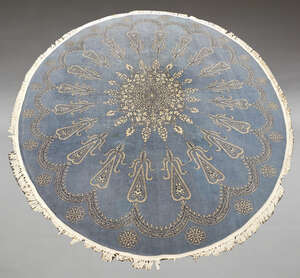 
	
		A large oval machine-made carpet, late 20th century, decorated with central pole...