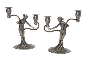 
	
		WMF, a pair of Art Nouveau pewter and brass figural candelabra
		c.1906, faint stamped...