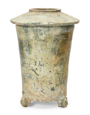 
	
		A Chinese pottery green-glazed granary jar, Han dynasty, the sloped cover incised with...