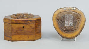 
	
		A Palestinian olive wood box, with canted corners and Hebrew inscriptions, carved in...