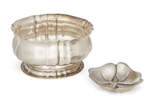An oval silver bowl, by Buccellati, of hammered design, the scalloped edge to crimped body raised on an oval foot, 15cm long, together with a pin dish designed