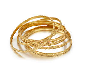 A group of six 22ct. gold bangles, each with chased decoration, approximate total weight 80.0g (6)
