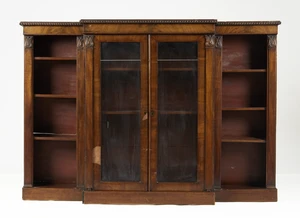 A William IV mahogany breakfront bookcase, second quarter 19th century, the beaded edge above...
