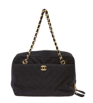 
	
		A Chanel clutch bag, the rectangular form black fabric body designed with central yellow...