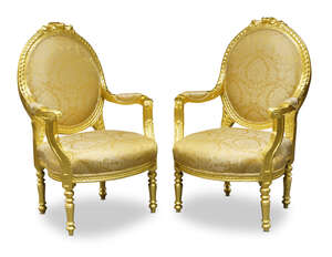 
	
		A pair of Louis XVI style giltwood fauteuils, second half 20th century, the oval backs...