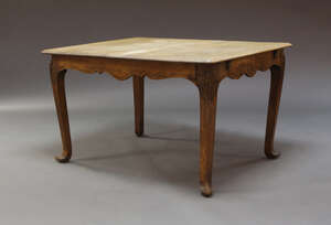 
	
		An oak dining table, early 20th Century, the rounded rectangular top, on acanthus capped...