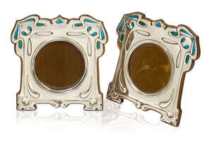 Connell & Co, a pair of Arts and Crafts silver and enamel photograph frames
		LGC mark for Connell & Co, London hallmarks for 1903, RD. 404506
		The silver e