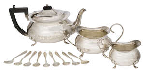 
	
		A three-piece silver tea set, Birmingham, c.1922, F. H. Adams & Cote, comprising a...