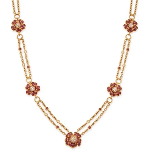 A ruby and diamond floral necklace, the floral panels pav&eacute;-set with brilliant-cut diamonds with...
