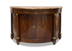 
	
		A French Empire ormolu-mounted mahogany demi-lune commode, early 19th century, the top...
