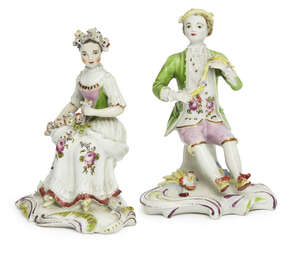 
	
		A pair of English porcelain figures of a seated boy and girl, 18th century, he wearing a...