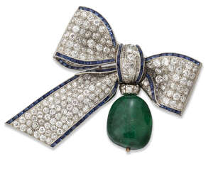 
	
		An emerald, diamond and sapphire brooch, designed as a ribbon tied bow pave set with...
