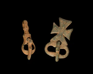 Two Byzantine bronze buckles,circa 5th-6th Century A.D.
one with a cross, 3.8cm, the other...