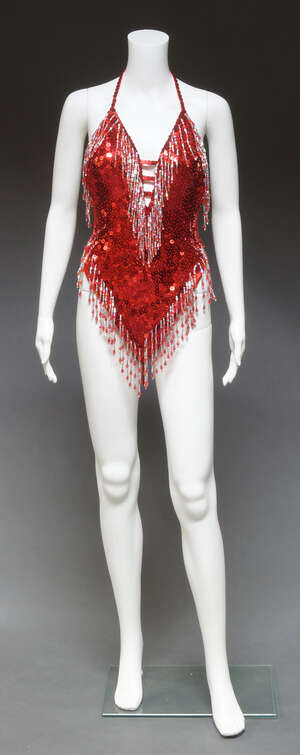 
	
		A risqué spangled cabaret outfit, together with another similar (2)  

	

