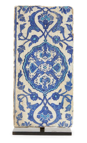 
	
		A blue and white Iznik pottery border tile, Ottoman Turkey, circa 1530, of rectangular...