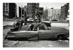 
	
		Eli Reed,
		American b.1948-
		 
		Kids on the Car, A Long Walk Home, 2017;
		 
		offset...