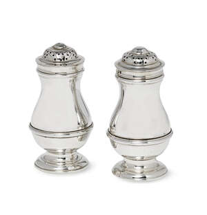 
	
		A pair of silver pepper pots, mark of JCL, London 1967 & 1969, each of baluster form with...