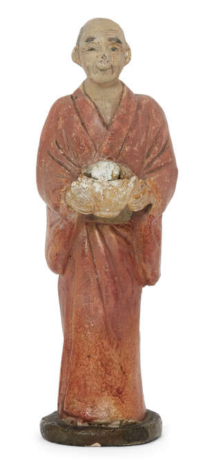 
	
		A Japanese figure of a man holding a brimming bowl, Meiji period, painted composite, 13cm...