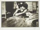 
	
		Eve Arnold OBE Hons FRPS, 
		American, 1912-2012- 
		Bargirl in brothel in the red...
