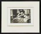 
	
		Eve Arnold OBE Hons FRPS, 
		American, 1912-2012- 
		Bargirl in brothel in the red...