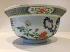 
	
		A Chinese porcelain boy and chicken bowl, 19th century, painted in famille verte enamels...