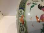 
	
		A Chinese porcelain boy and chicken bowl, 19th century, painted in famille verte enamels...
