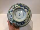 
	
		A Chinese porcelain boy and chicken bowl, 19th century, painted in famille verte enamels...