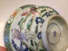 
	
		A Chinese porcelain boy and chicken bowl, 19th century, painted in famille verte enamels...